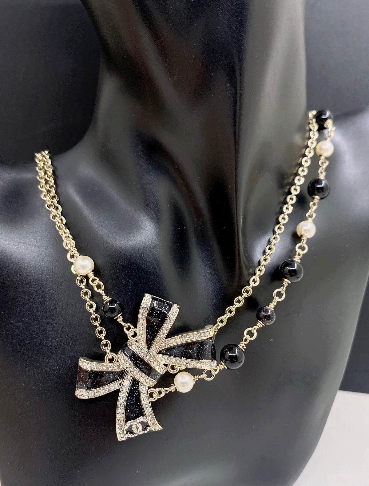Bow Pendant Necklace in Gold-Tone – Black Detail – Design 002 front product view