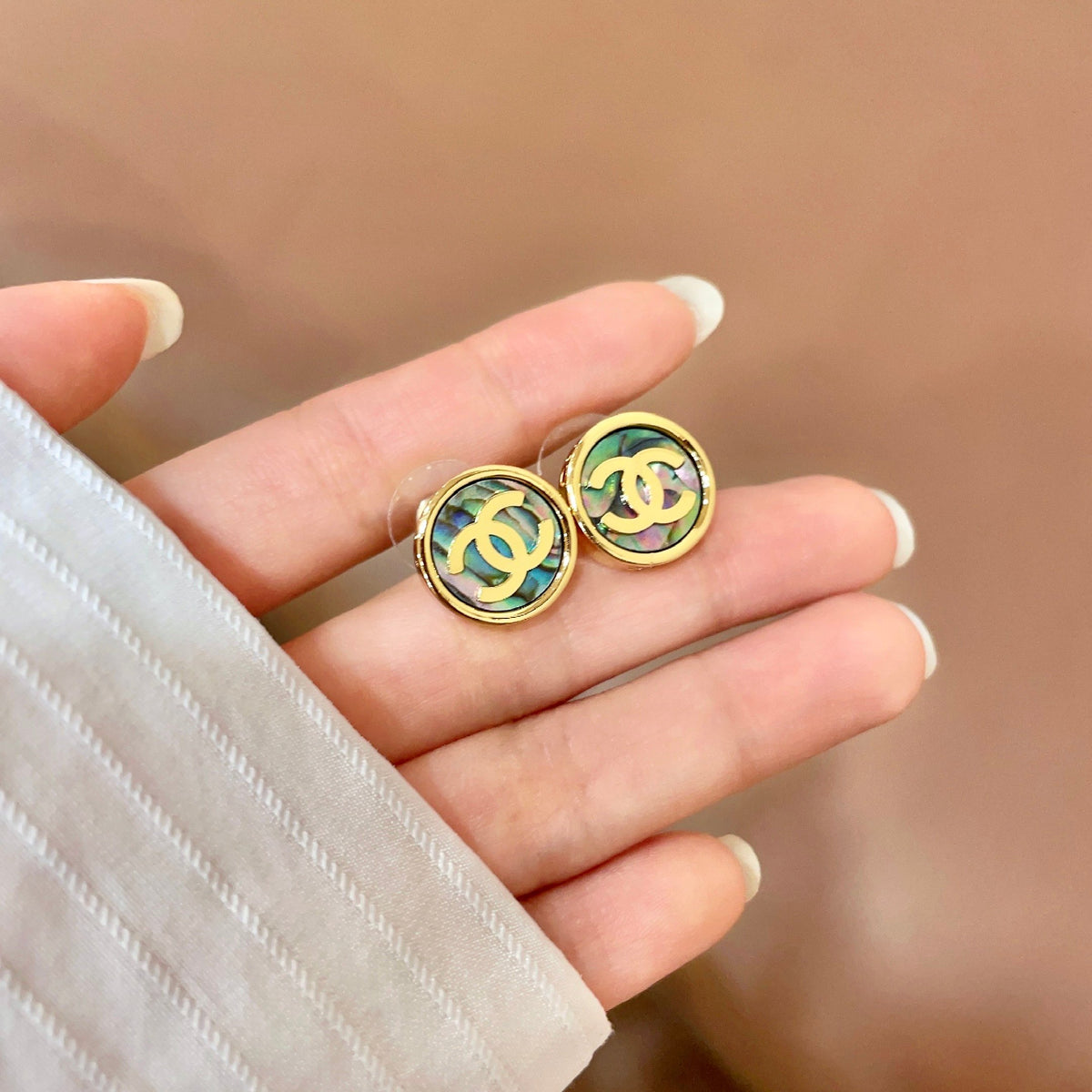 Double-C Emblem Stud Earrings in Polished Metal-Tone – Design 300 side detail