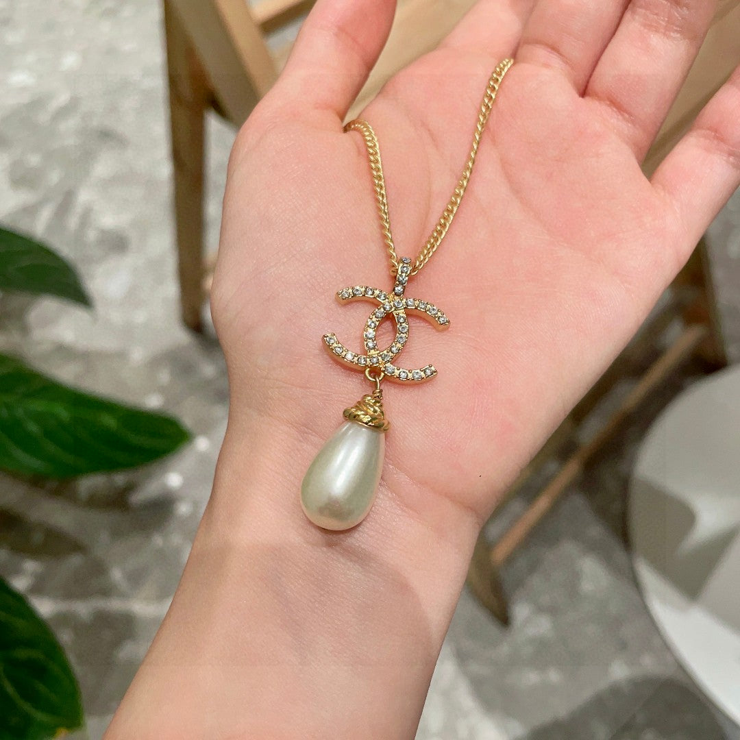 Double-C Emblem Pearl-Detail Pendant Necklace – Pearl Detail – Design 129 side detail