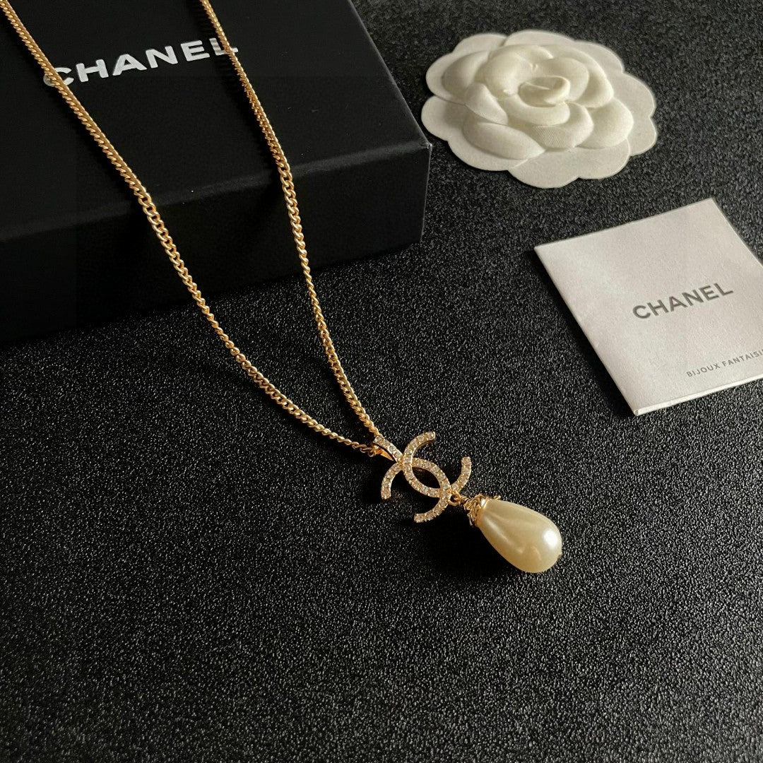 Double-C Emblem Pearl-Detail Pendant Necklace – Pearl Detail – Design 131 styled product view