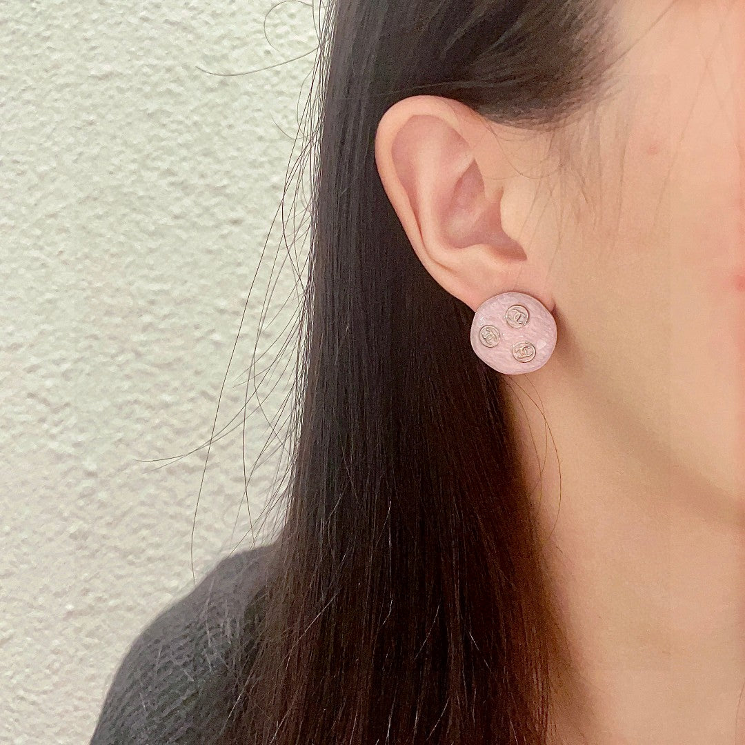 Double-C Emblem Stud Earrings in Polished Metal-Tone – Design 123 detail view