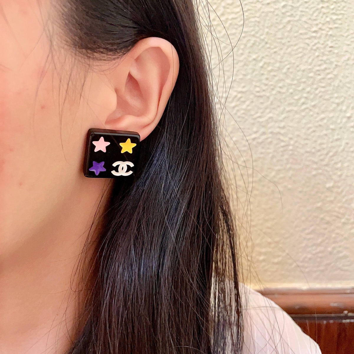 Double-C Emblem Stud Earrings in Polished Metal-Tone – Star Detail – Design 010 detail view