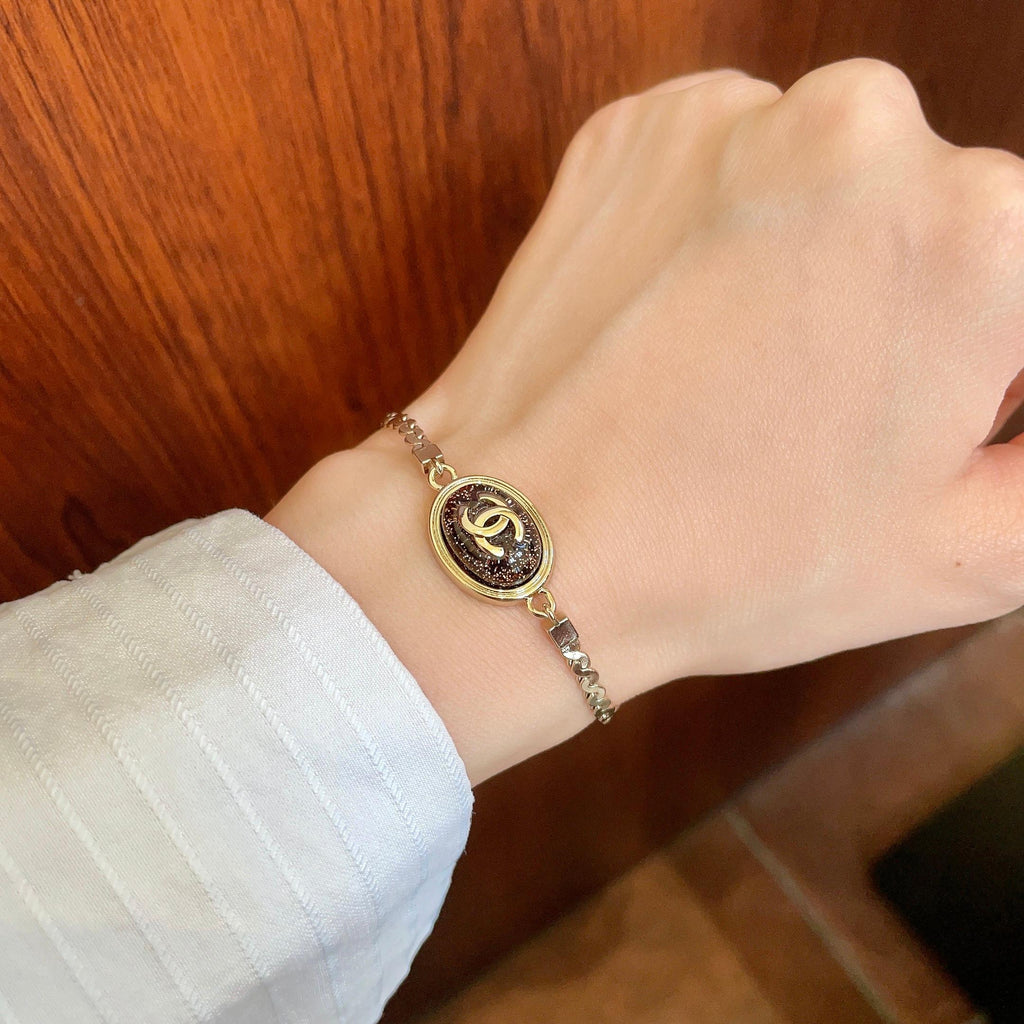Double-C Emblem Bracelet in Polished Metal-Tone – Design 001 front product view