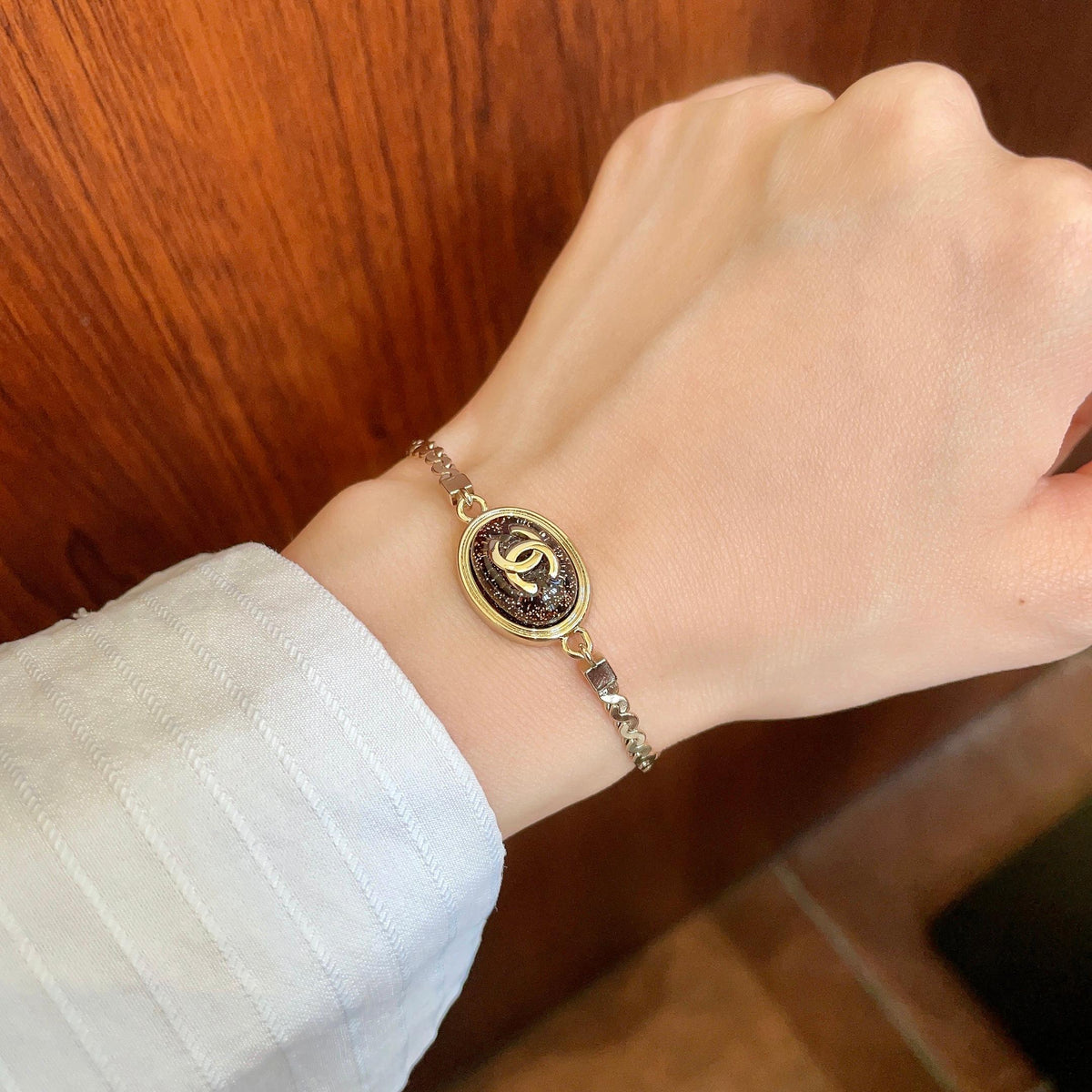 Double-C Emblem Bracelet in Polished Metal-Tone – Design 004 front product view