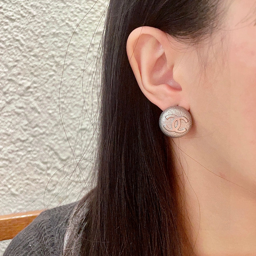 Double-C Emblem Stud Earrings in Polished Metal-Tone – Design 206 detail view