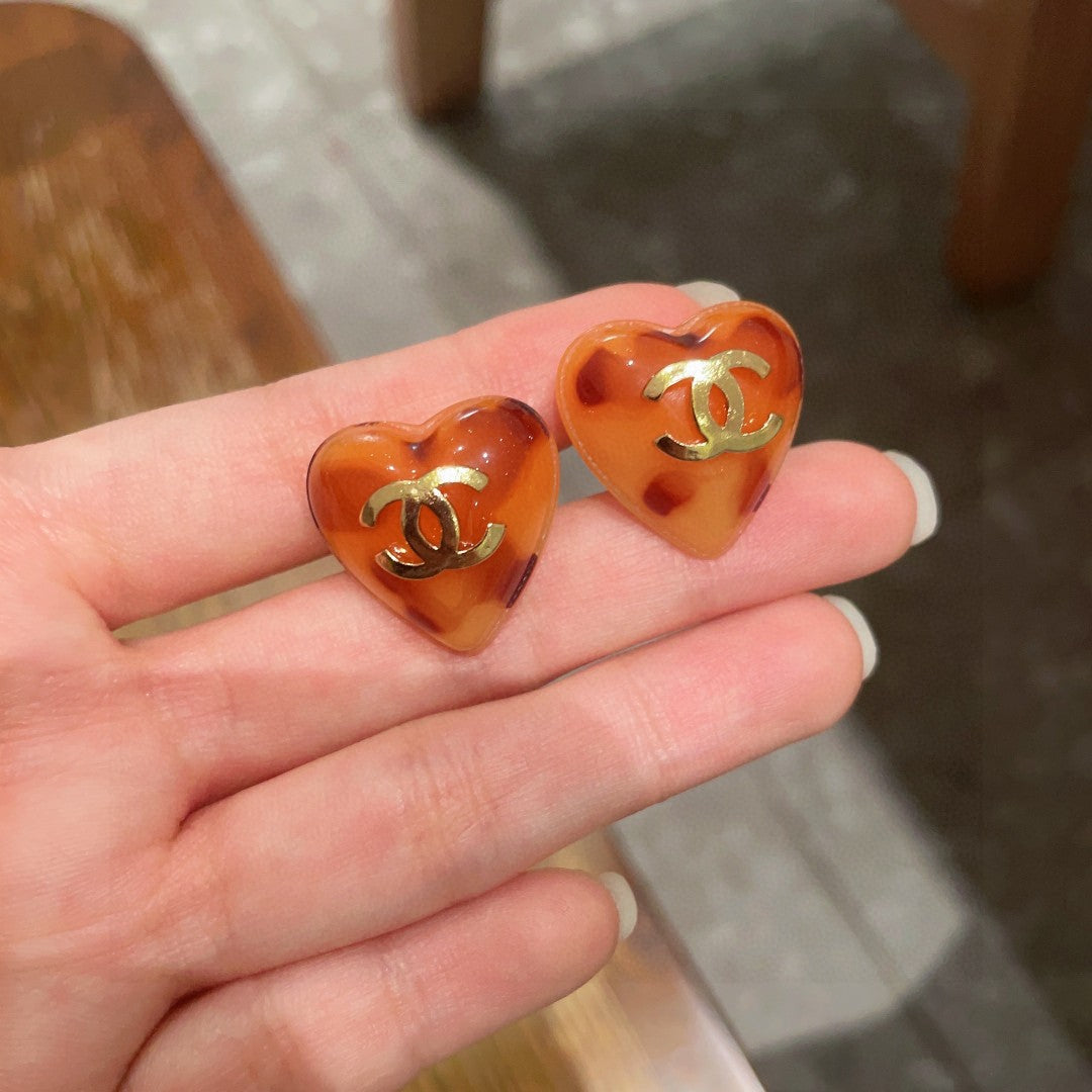 Double-C Emblem Stud Earrings in Polished Metal-Tone – Heart Detail – Design 013 side detail