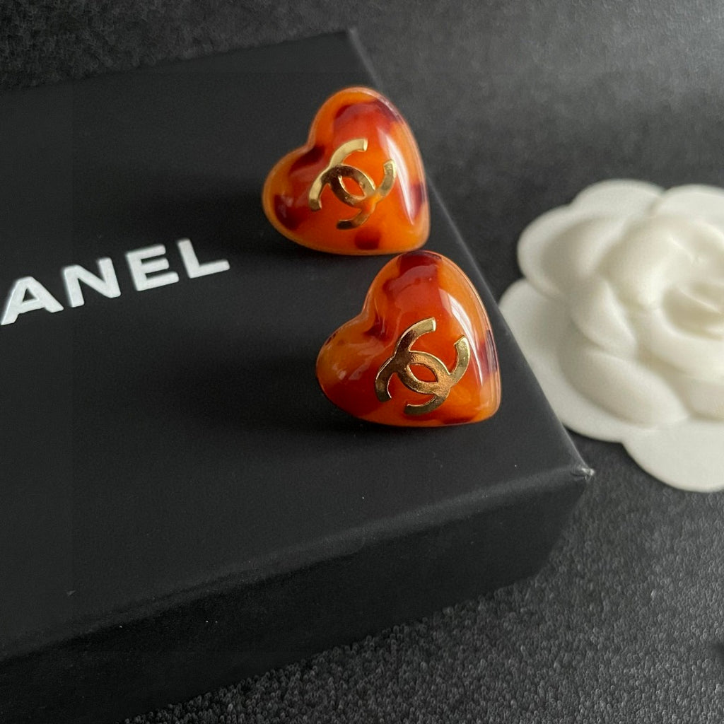 Double-C Emblem Stud Earrings in Polished Metal-Tone – Heart Detail – Design 013 detail view
