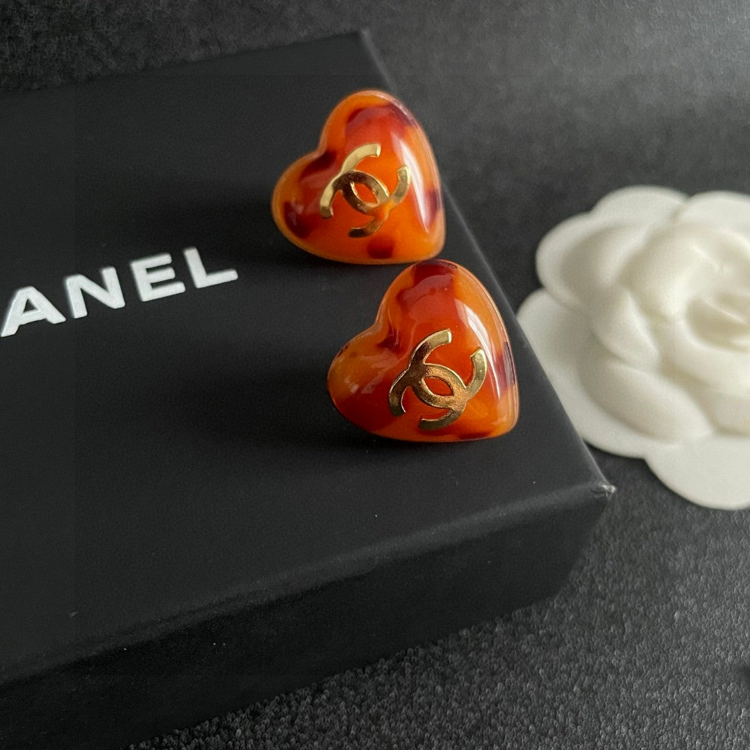 Double-C Emblem Stud Earrings in Polished Metal-Tone – Heart Detail – Design 013 detail view