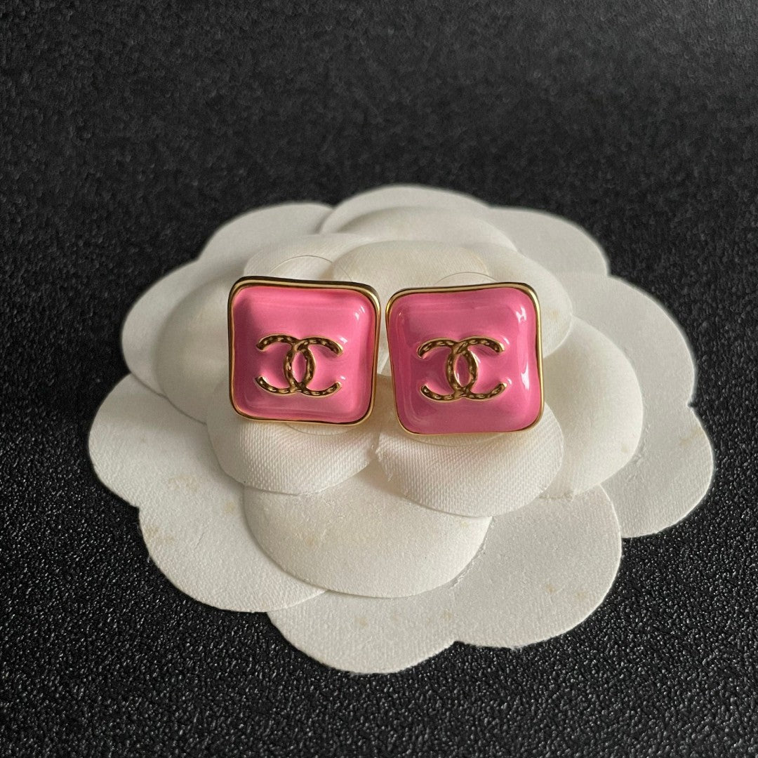 Double-C Emblem Stud Earrings in Polished Metal-Tone – Design 249 front product view