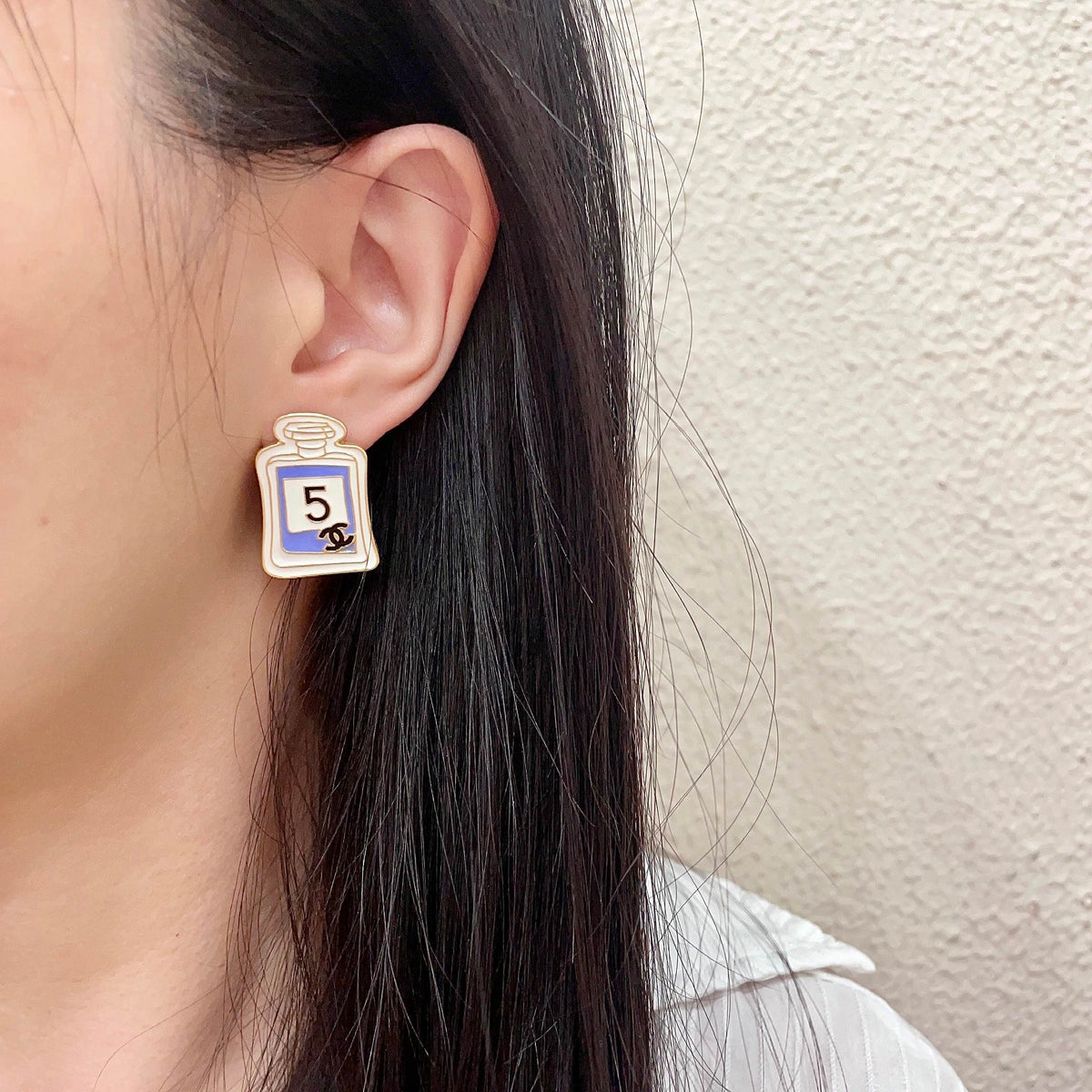Double-C Emblem Stud Earrings in Polished Metal-Tone – Design 219 detail view