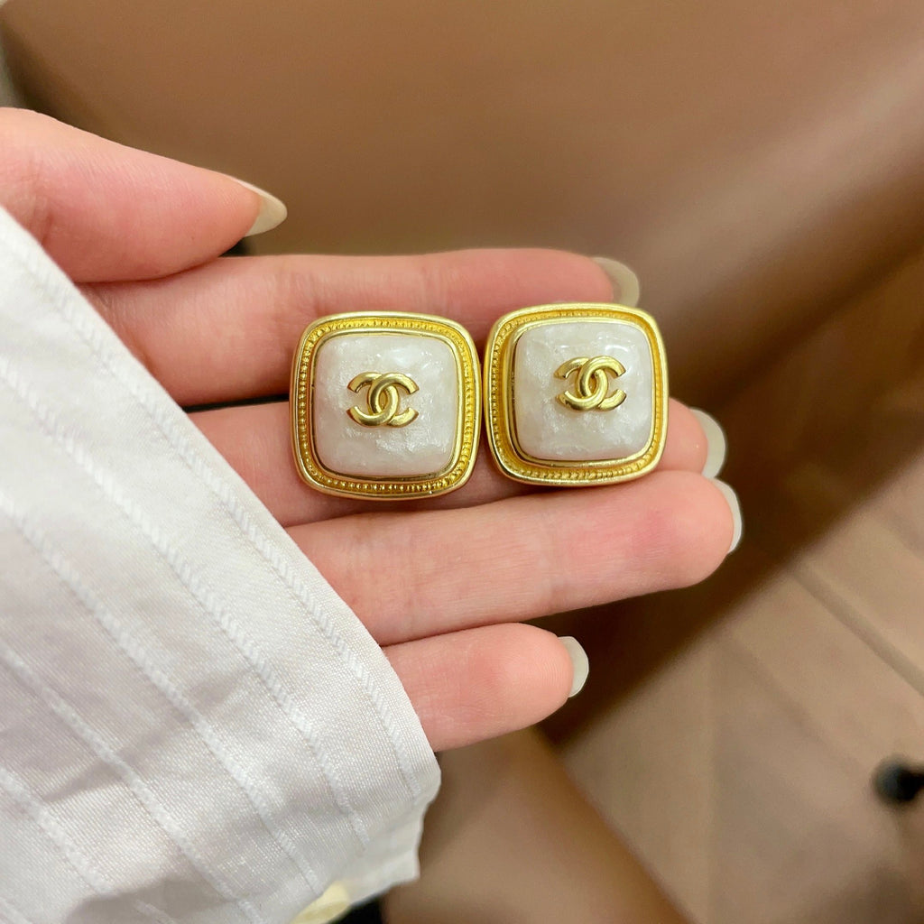 Double-C Emblem Stud Earrings in Polished Metal-Tone – Design 217 side detail