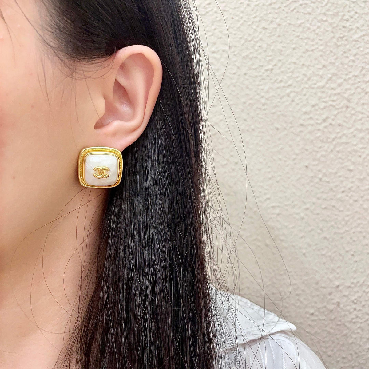 Double-C Emblem Stud Earrings in Polished Metal-Tone – Design 217 detail view