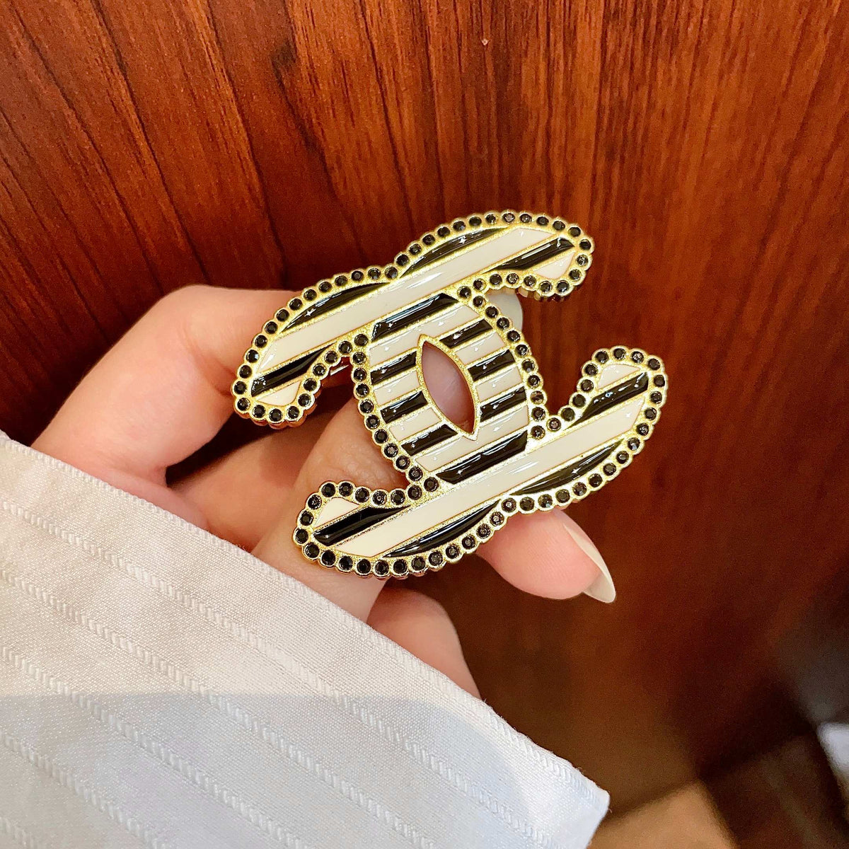 Double-C Emblem Brooch in Polished Metal-Tone – Design 066 detail view