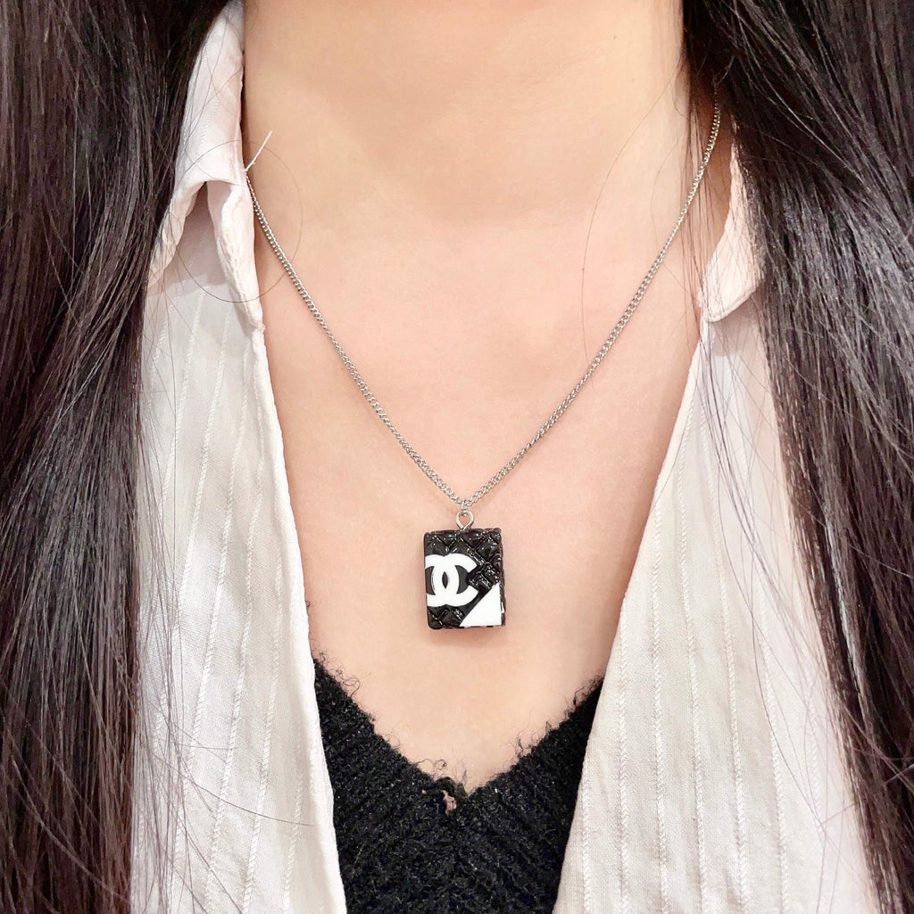 Double-C Emblem Pendant Necklace in Polished Metal-Tone – Design 042 detail view