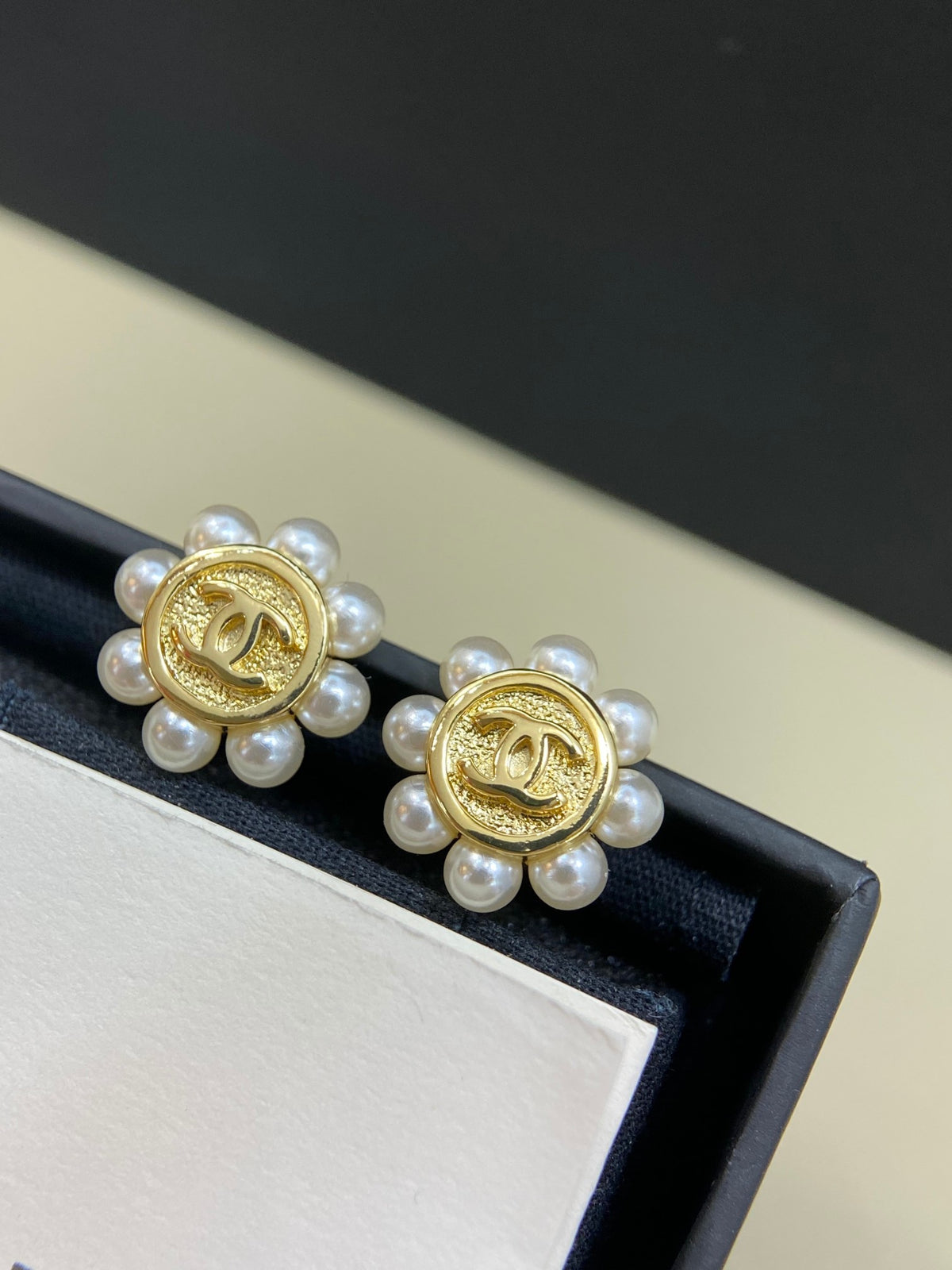 Double-C Emblem Stud Earrings in Polished Metal-Tone – Design 299 detail view