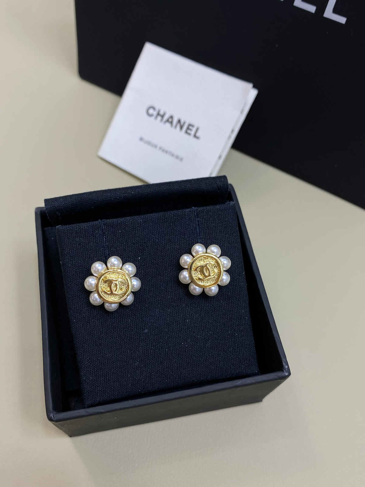 Double-C Emblem Stud Earrings in Polished Metal-Tone – Design 299 front product view