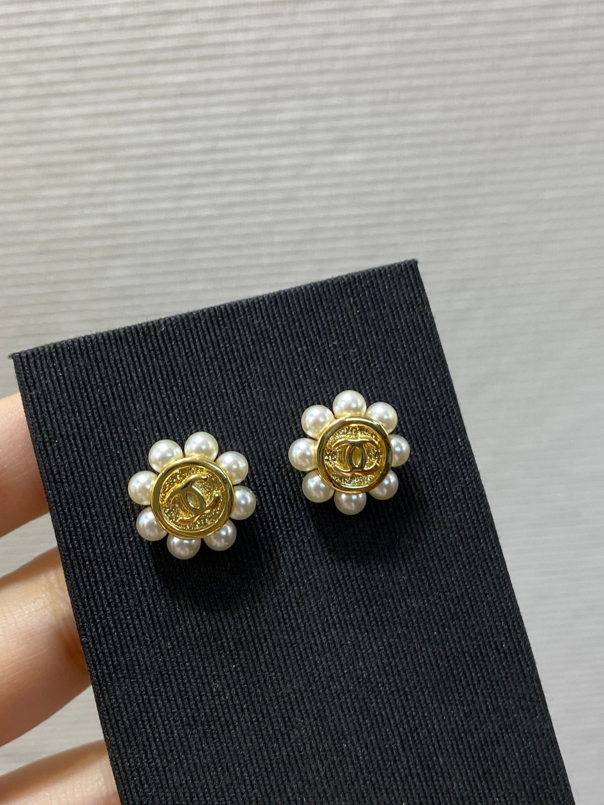 Double-C Emblem Stud Earrings in Polished Metal-Tone – Design 299 close-up detail