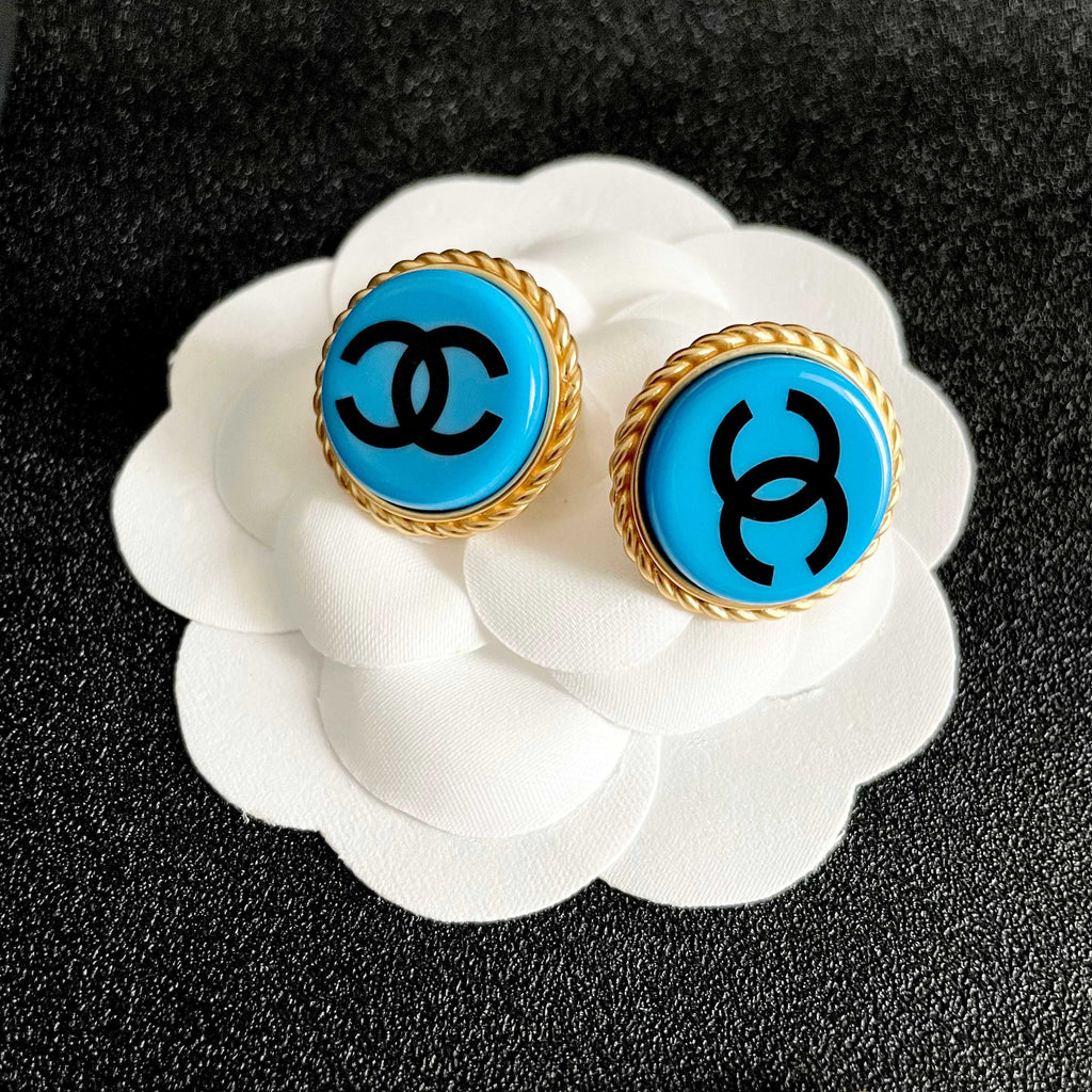 Double-C Emblem Stud Earrings in Polished Metal-Tone – Design 216 front product view