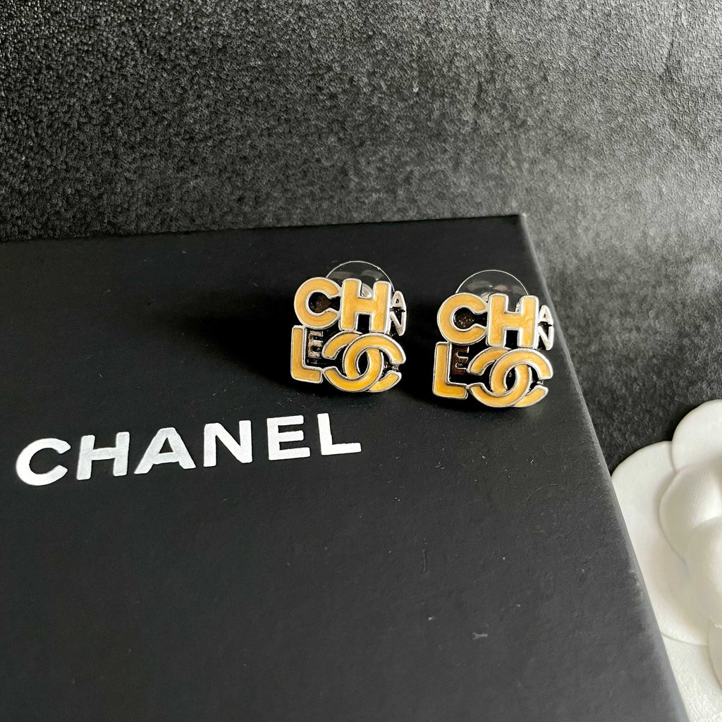 Double-C Emblem Stud Earrings in Polished Metal-Tone – Design 212 detail view