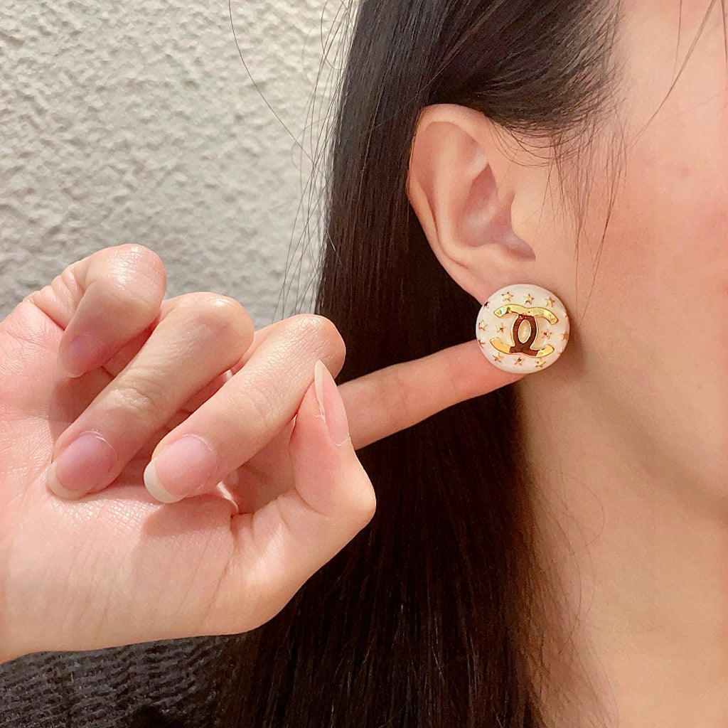 Double-C Emblem Stud Earrings in Polished Metal-Tone – Star Detail – Design 013 front product view