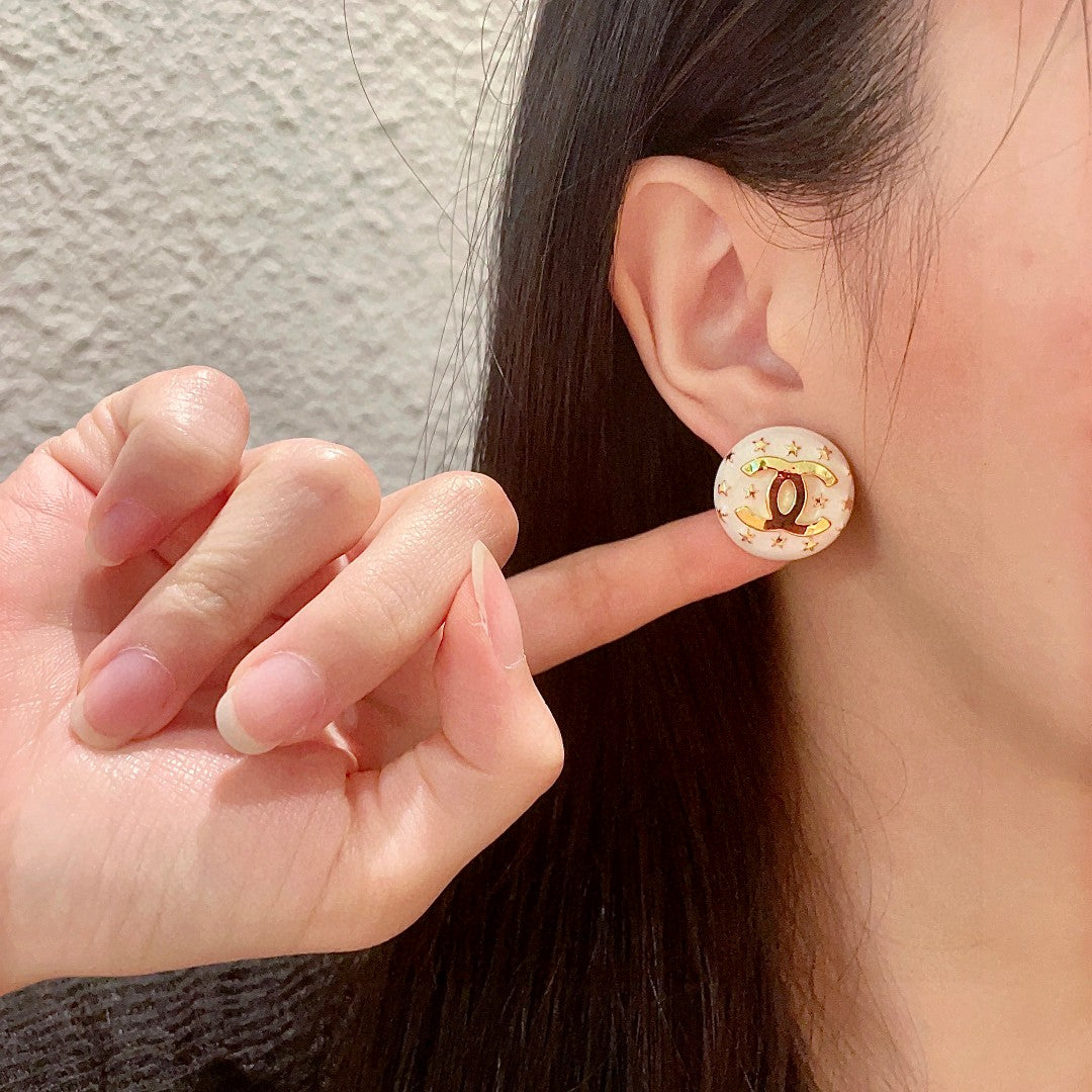 Double-C Emblem Stud Earrings in Polished Metal-Tone – Star Detail – Design 017 front product view