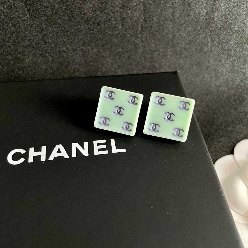 Double-C Emblem Stud Earrings in Polished Metal-Tone – Design 274 detail view