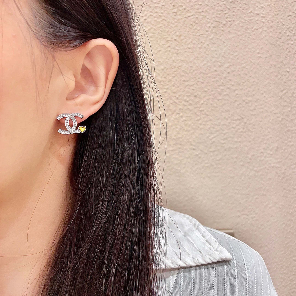Signature Emblem Stud Earrings in Polished Metal-Tone – Design 053 detail view