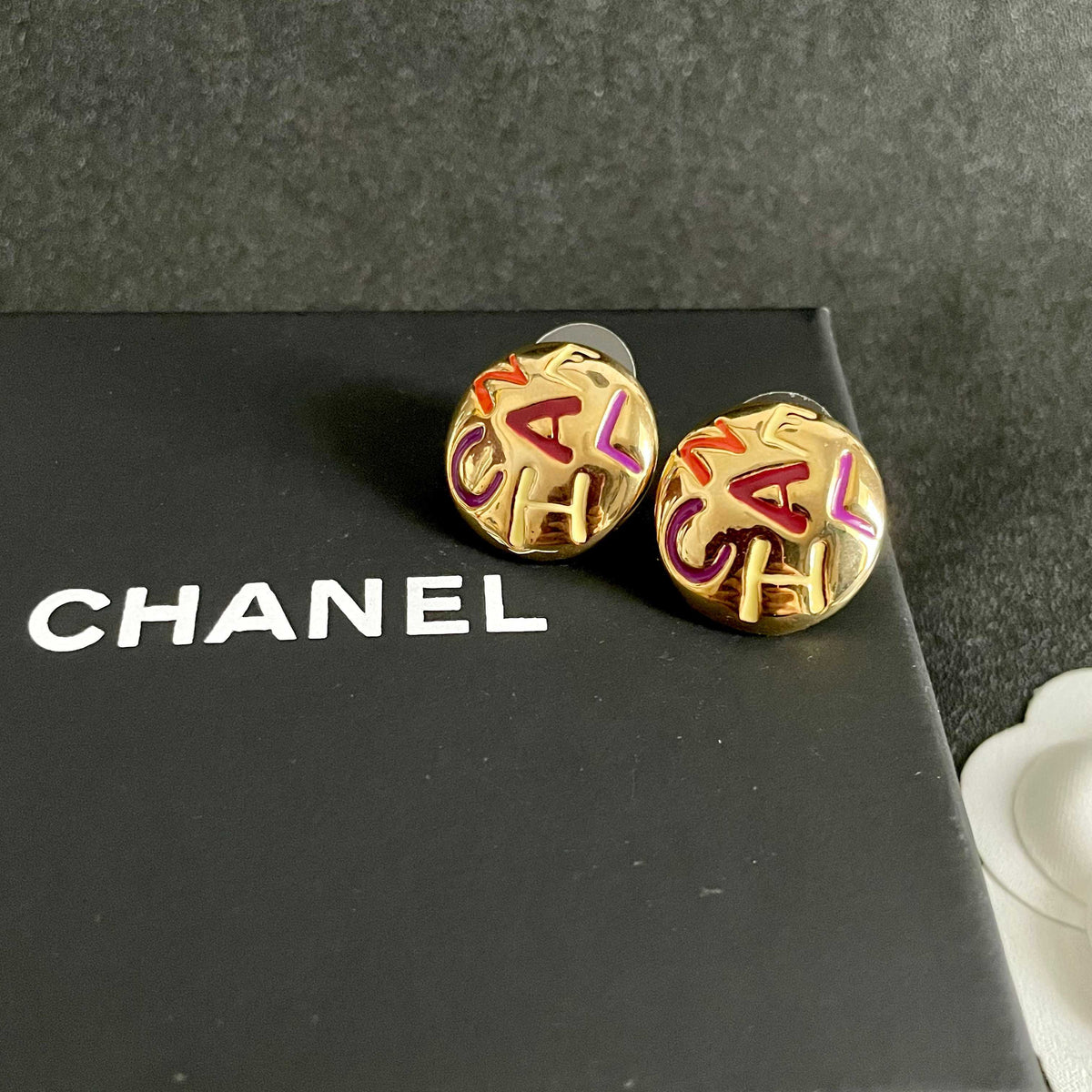 Double-C Emblem Stud Earrings in Polished Metal-Tone – Design 245 detail view