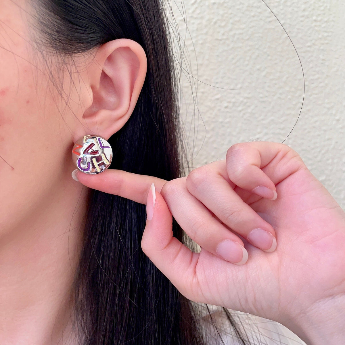Double-C Emblem Stud Earrings in Polished Metal-Tone – Design 244 front product view