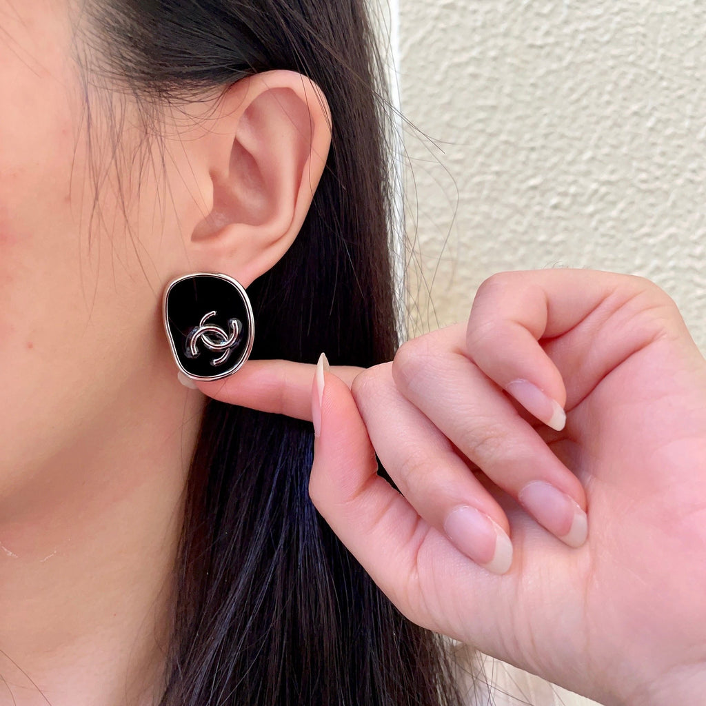 Double-C Emblem Stud Earrings in Polished Metal-Tone – Design 331 front product view