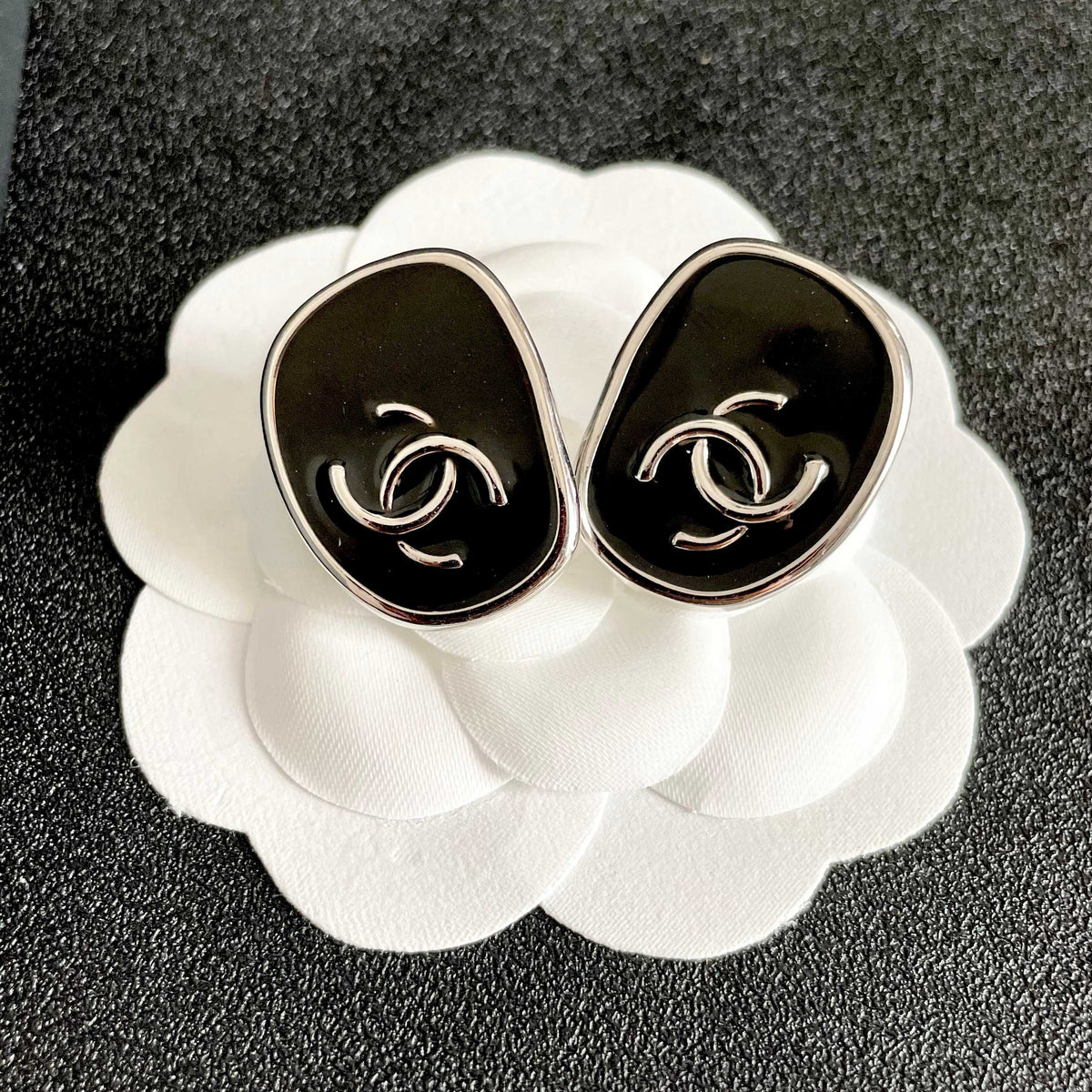 Double-C Emblem Stud Earrings in Polished Metal-Tone – Design 313 front product view