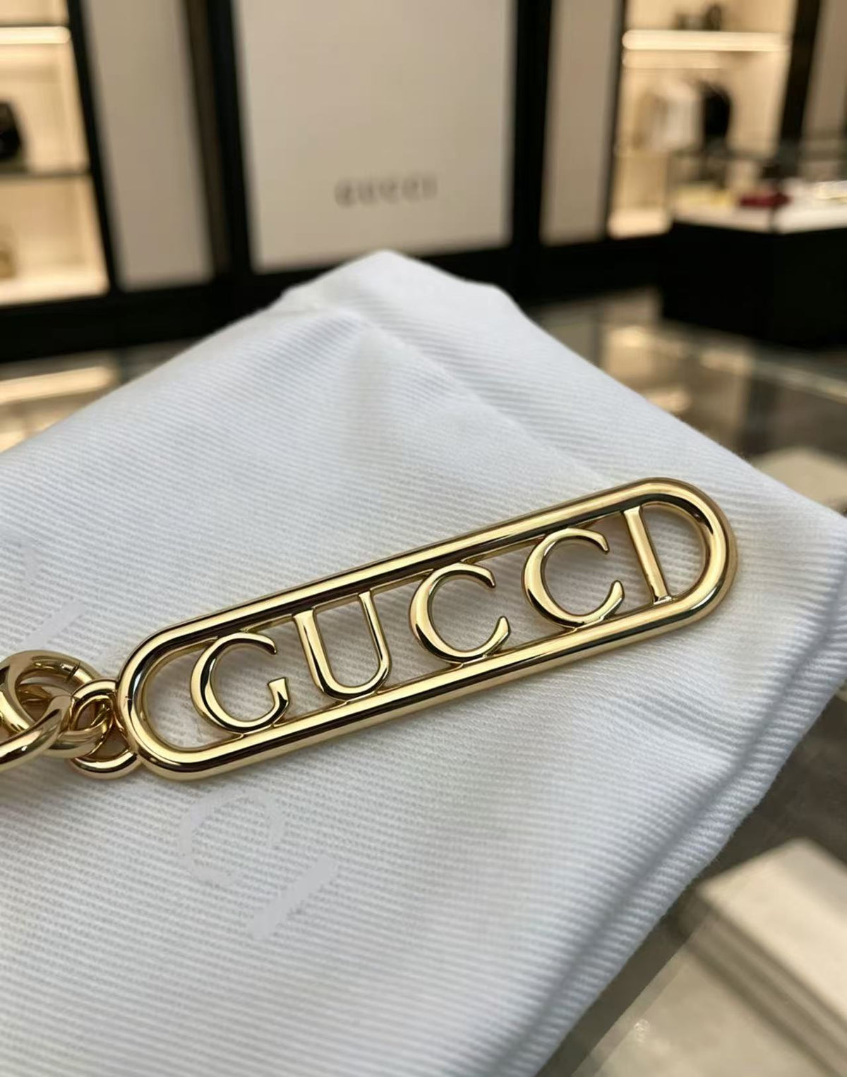 Letter Emblem Keychain in Polished Metal-Tone detail view