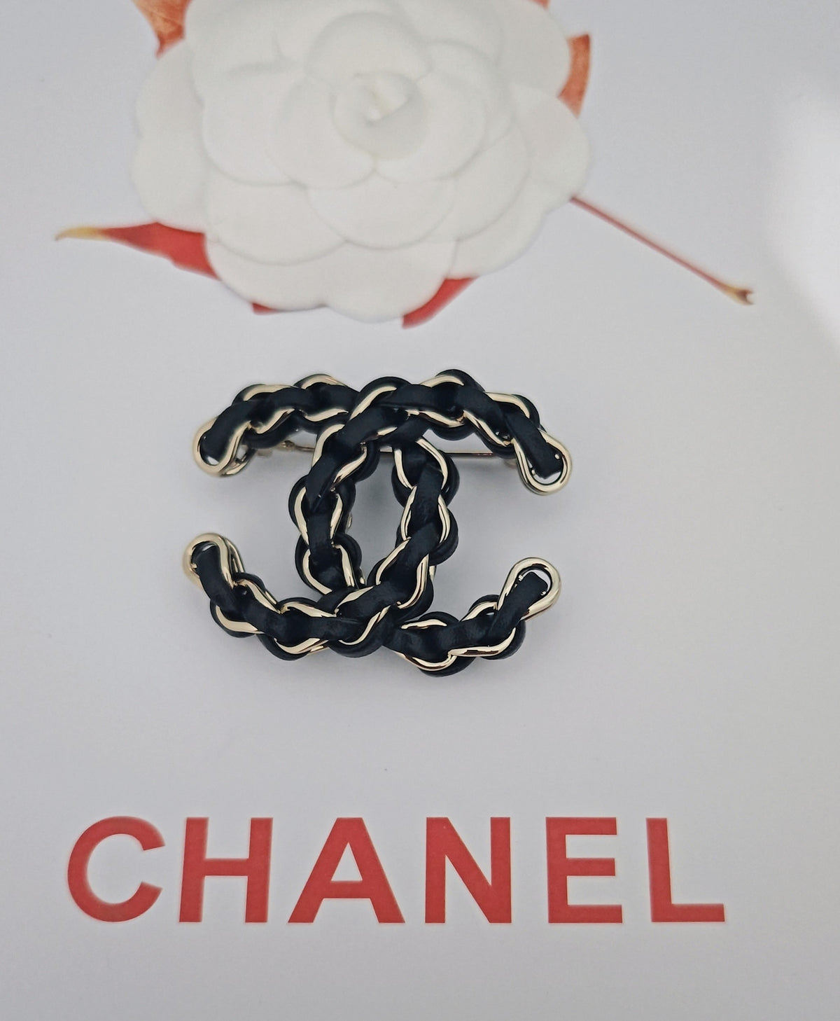Signature Emblem Brooch in Gold-Tone – Black Detail side detail