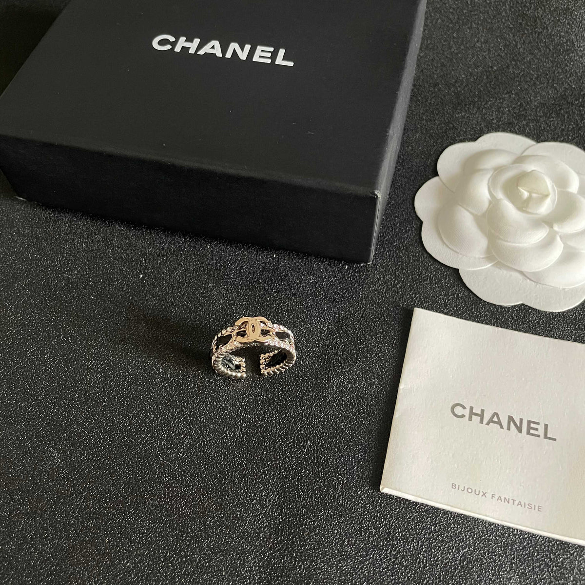 Double-C Emblem Statement Ring in Polished Metal-Tone – White Detail – Design 003 close-up detail