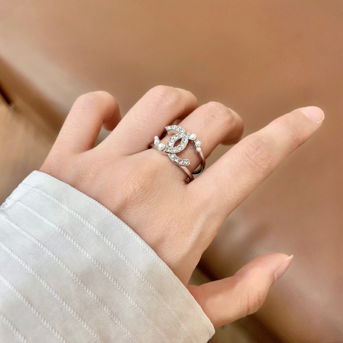 Double-C Emblem Statement Ring in Polished Metal-Tone – White Detail – Design 002 front product view