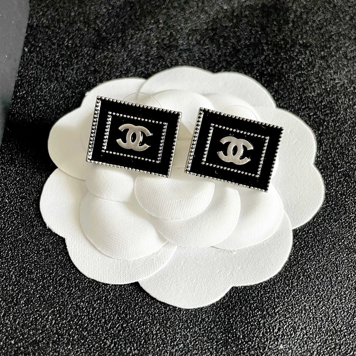 Double-C Emblem Stud Earrings in Polished Metal-Tone – Design 353 front product view