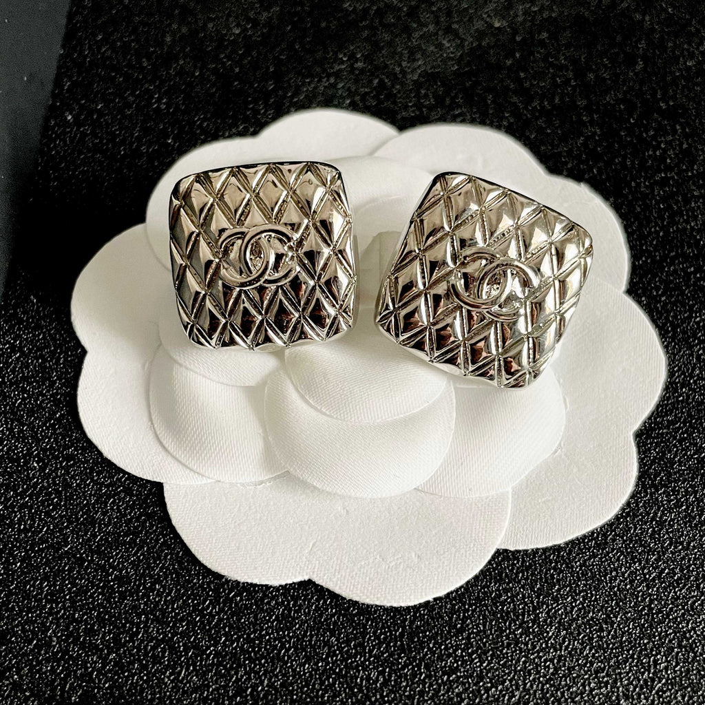 Double-C Emblem Stud Earrings in Polished Metal-Tone – Design 425 front product view