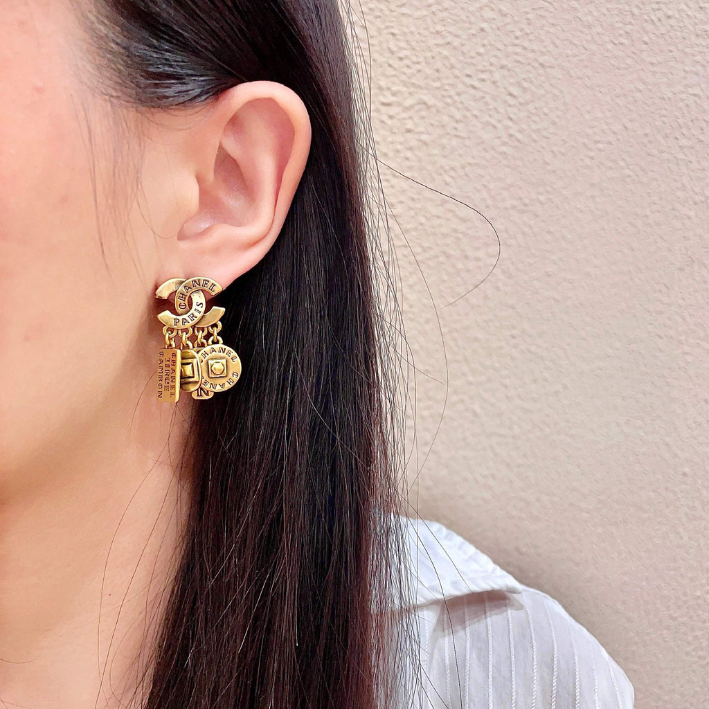 Double-C Emblem Stud Earrings in Polished Metal-Tone – Design 450 detail view