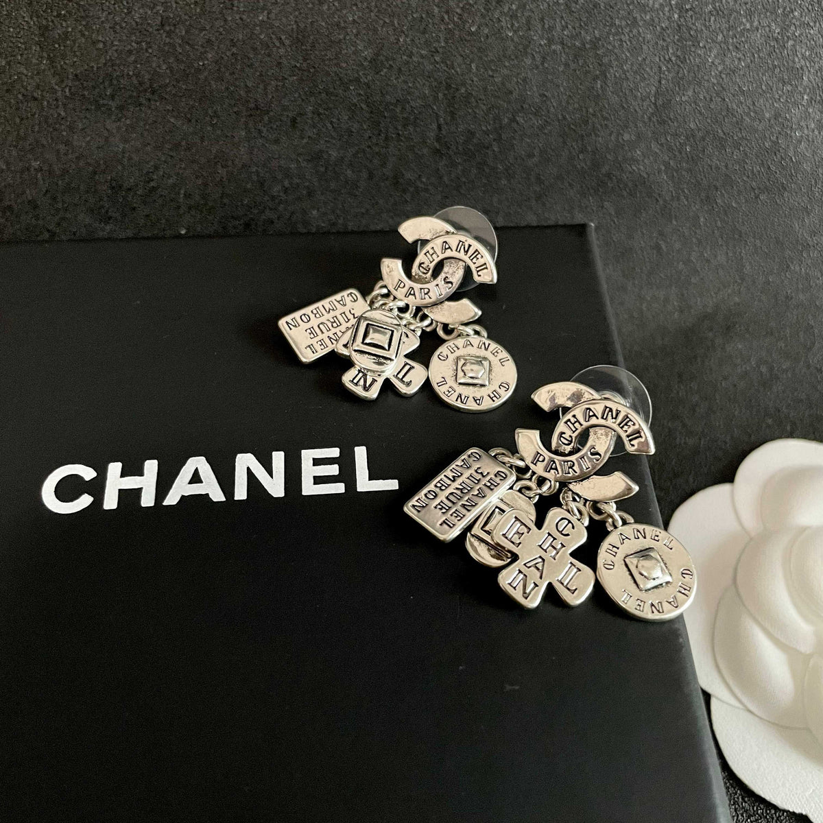 Double-C Emblem Stud Earrings in Polished Metal-Tone – Design 449 detail view