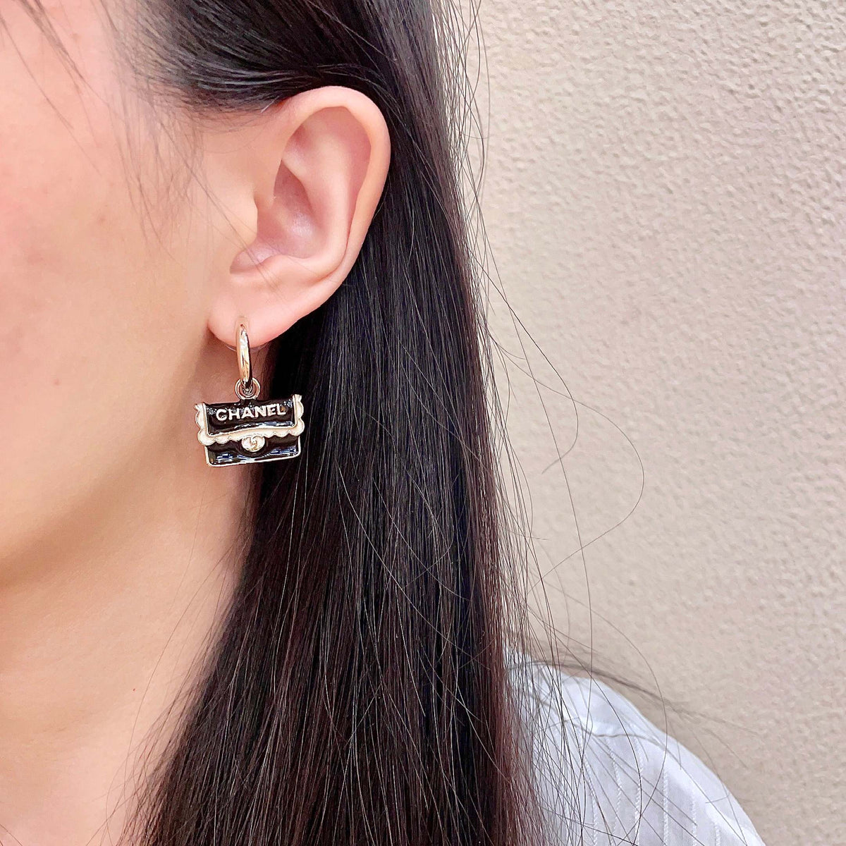 Double-C Emblem Stud Earrings in Polished Metal-Tone – Design 444 detail view