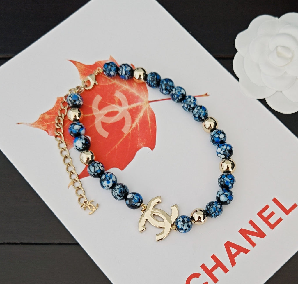 Signature Emblem Pendant Necklace in Gold-Tone – Blue Detail detail view