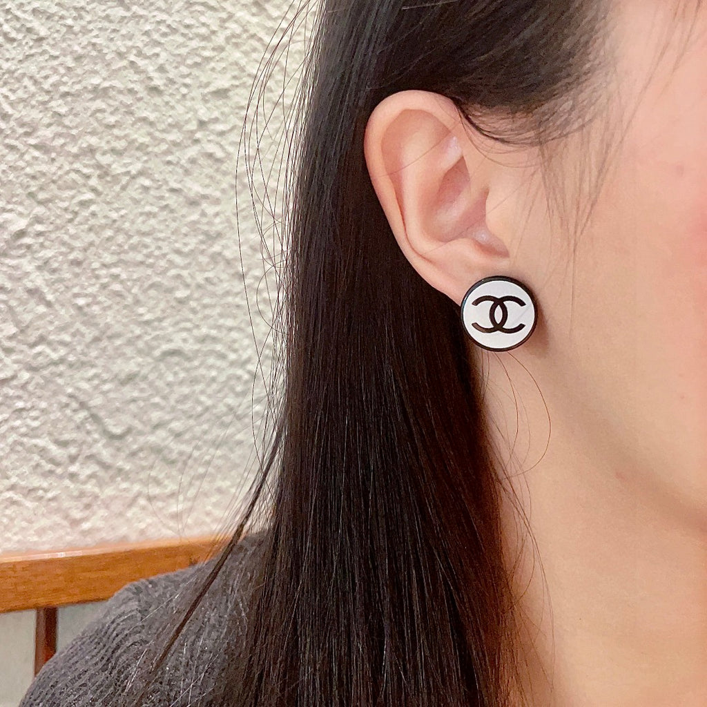 Double-C Emblem Stud Earrings in Polished Metal-Tone – Design 470 detail view