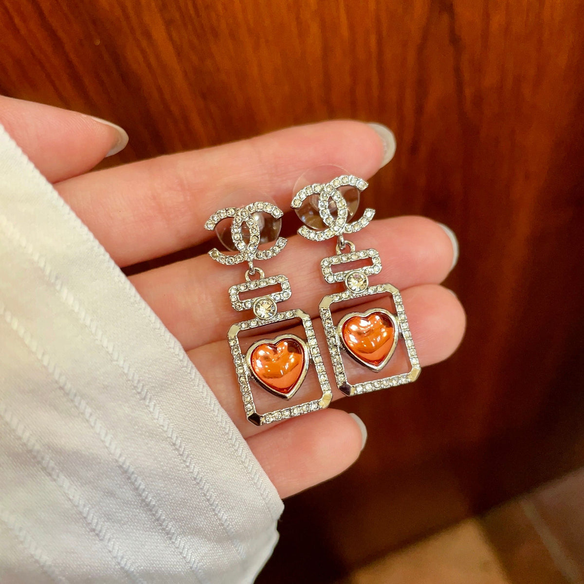 Double-C Emblem Statement Earrings in Polished Metal-Tone – Heart Detail – Design 007 side detail