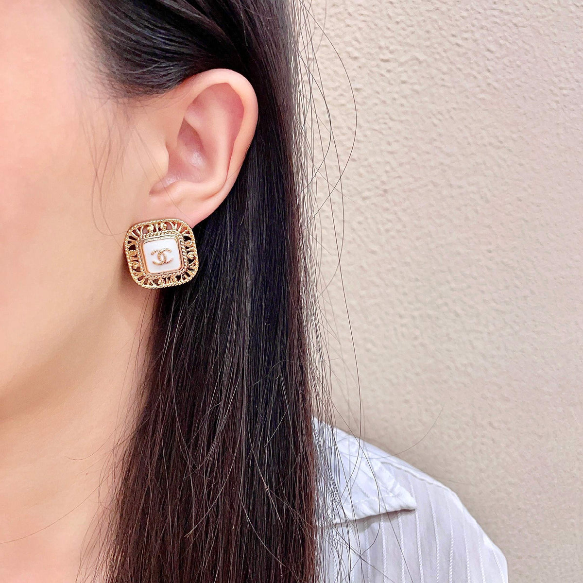 Double-C Emblem Stud Earrings in Polished Metal-Tone – Design 139 detail view