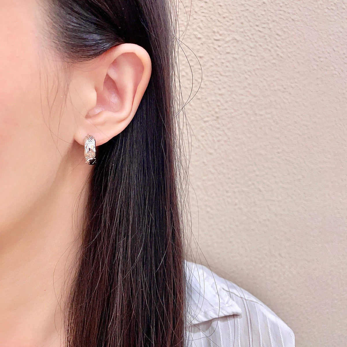 Double-C Emblem Stud Earrings in Polished Metal-Tone – Design 130 detail view
