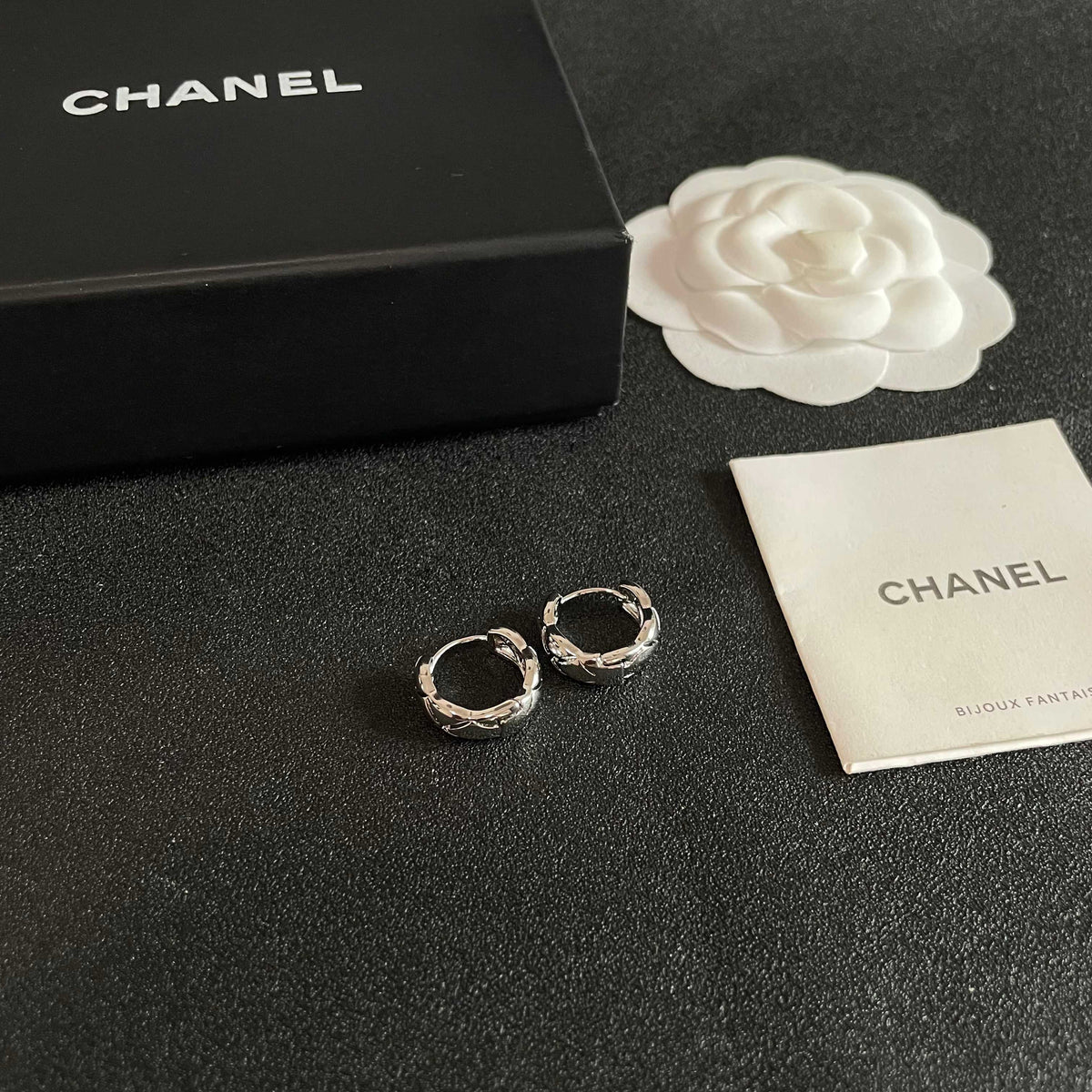 Double-C Emblem Stud Earrings in Polished Metal-Tone – Design 130 styled product view