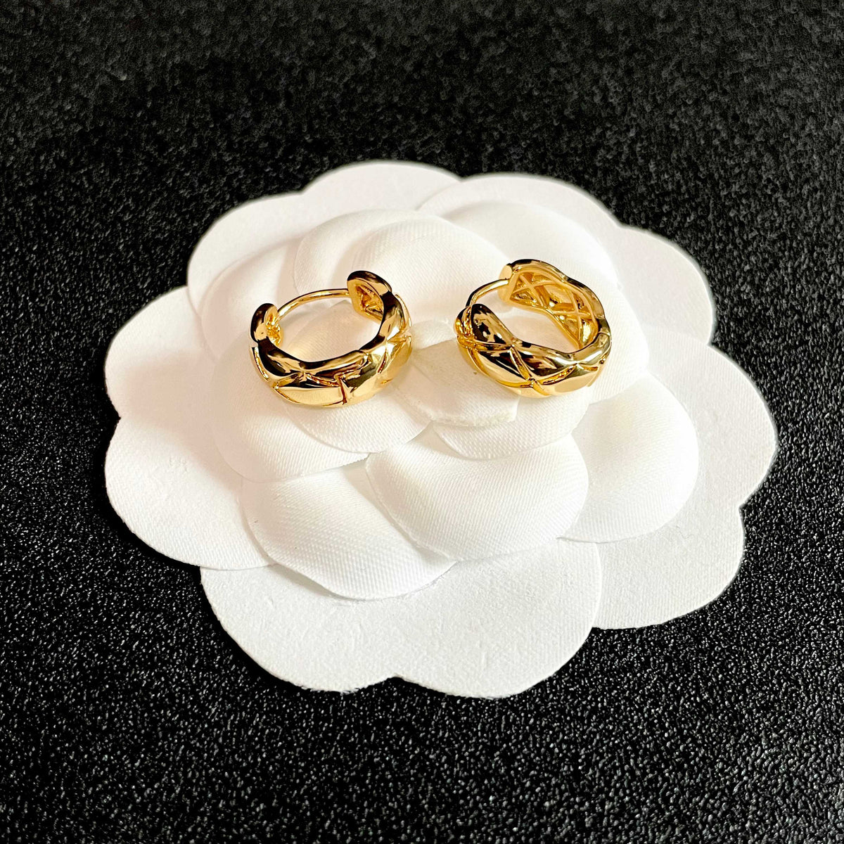 Double-C Emblem Stud Earrings in Polished Metal-Tone – Design 129 front product view