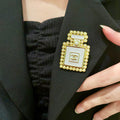 Double-C Emblem Brooch in Polished Metal-Tone – Pearl Detail – Design 002 main product view