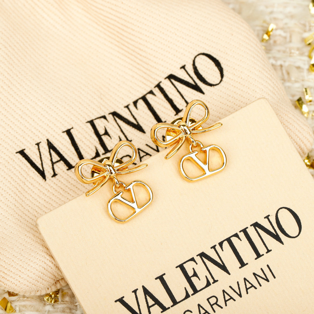 Bow Statement Earrings in Polished Metal-Tone detail view