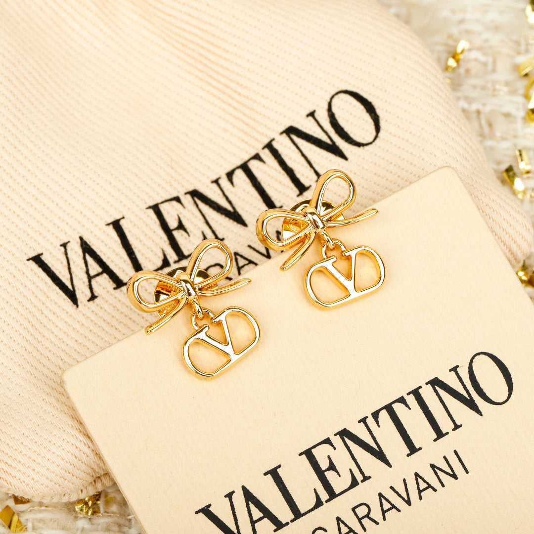 Bow Statement Earrings in Polished Metal-Tone detail view